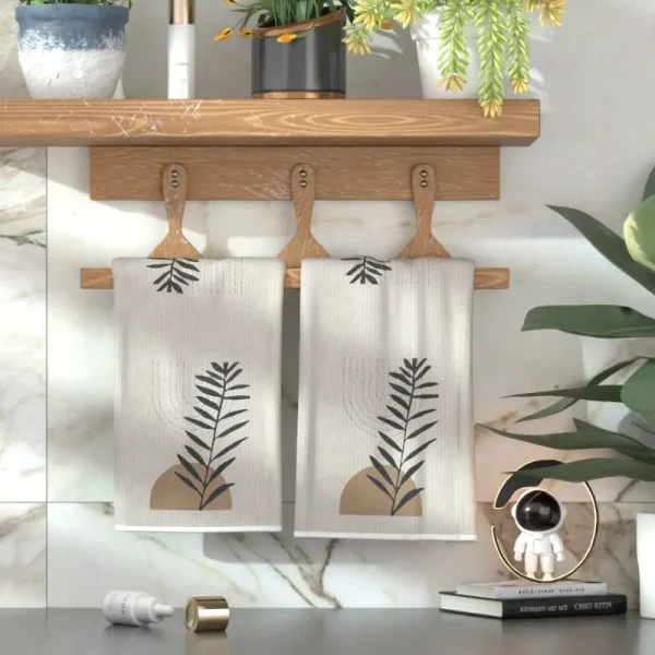 2 soft towels with abstract art plant patterns, stylish beige and black leaf designs, suitable for kitchens, bathrooms, or gyms 5
