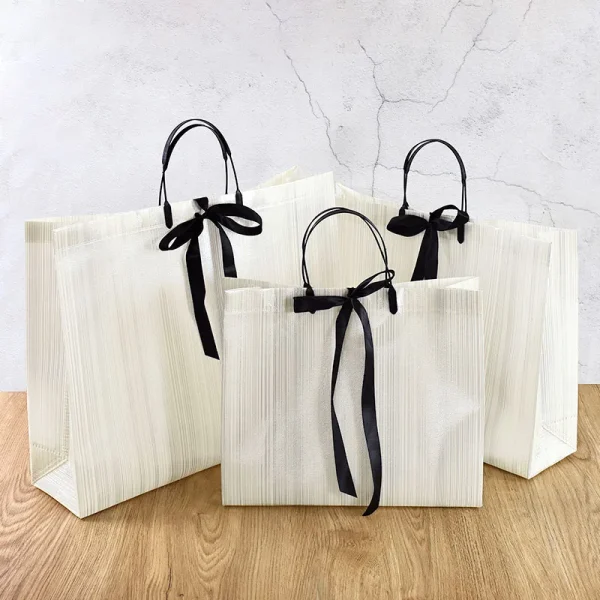 1pc Gift Packaging White Non-woven Bag With Black Border Shopping Bags Portable Tote Bags Bow Ribbon Dinner Party Supplies 1