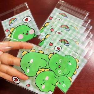 100pcs Green Dinosaur Graffiti Gift Packaging OPP Self-Sealing Bag, Green Grid Heart Rainbow Pattern Gift Card Decor OPP Bags 1