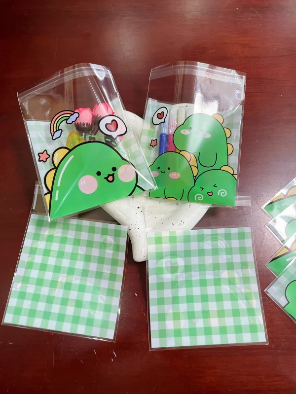 100pcs Green Dinosaur Graffiti Gift Packaging OPP Self-Sealing Bag, Green Grid Heart Rainbow Pattern Gift Card Decor OPP Bags 3