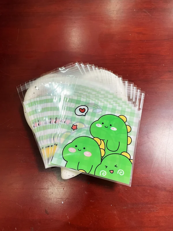 100pcs Green Dinosaur Graffiti Gift Packaging OPP Self-Sealing Bag, Green Grid Heart Rainbow Pattern Gift Card Decor OPP Bags 5